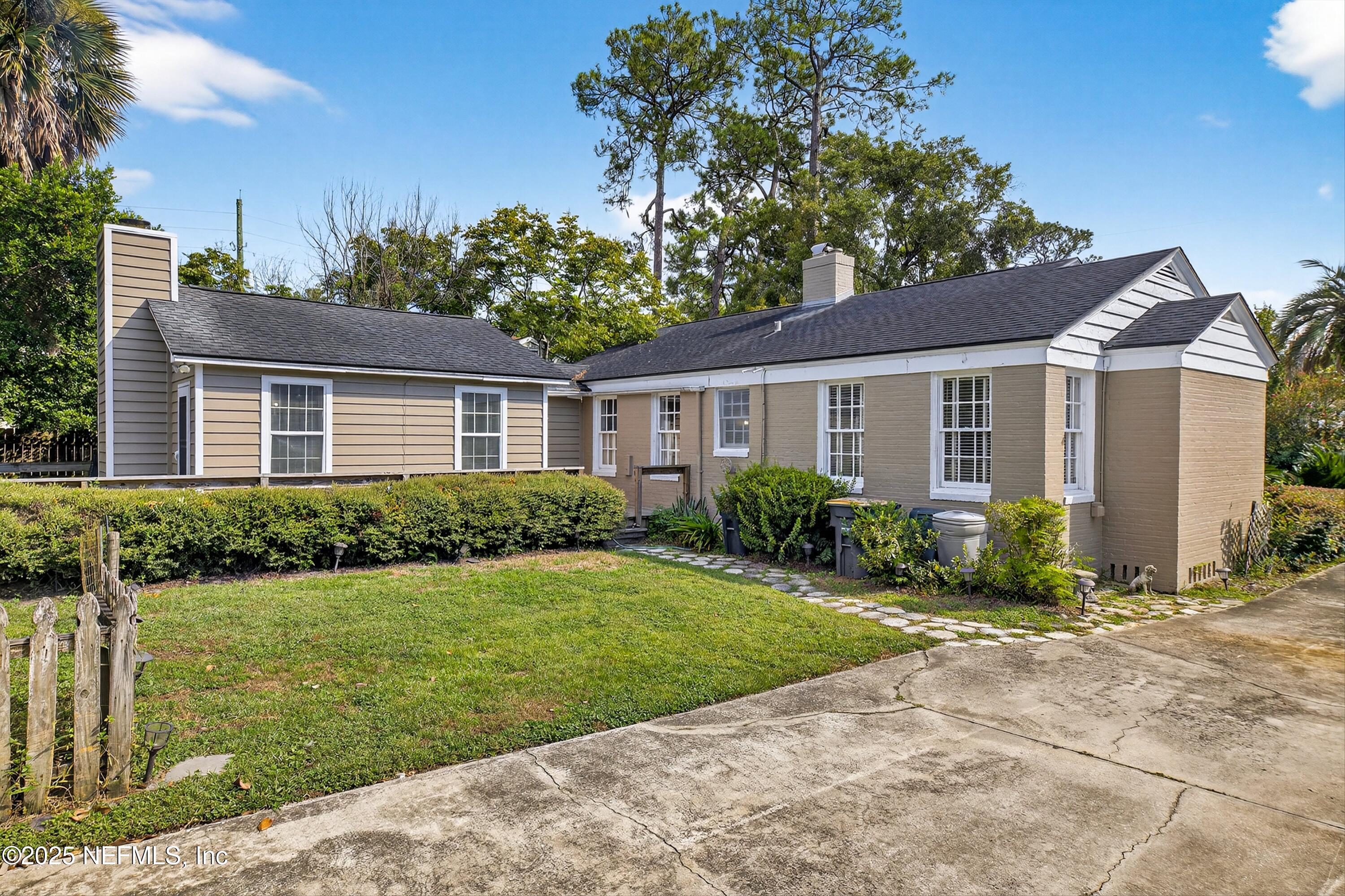 1425 Pinetree Road Jacksonville, FL 32207 - Photo 23 of 39 a front view of a house with a yard