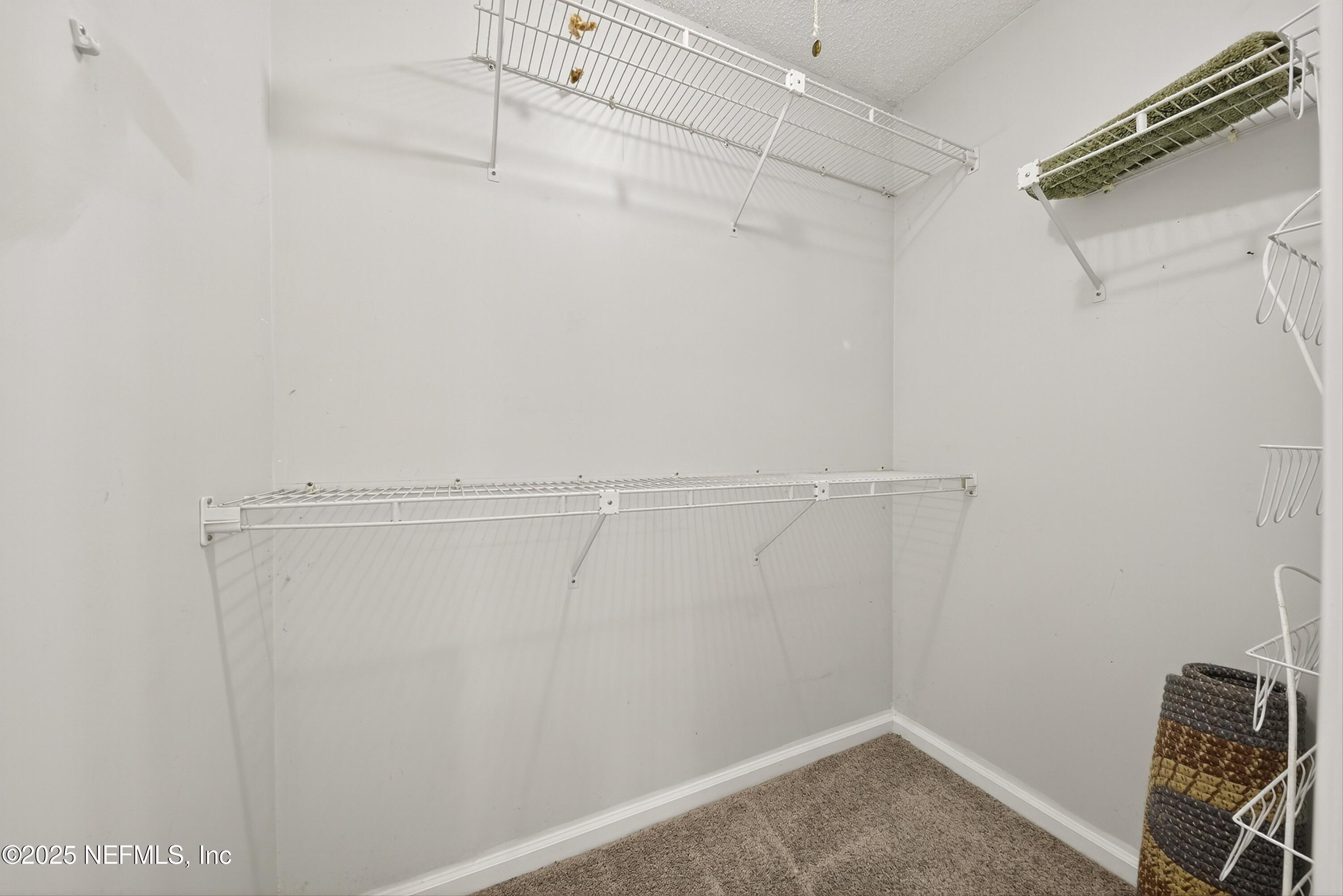 1425 Pinetree Road Jacksonville, FL 32207 - Photo 28 of 39 a view of a room with racks on the wall