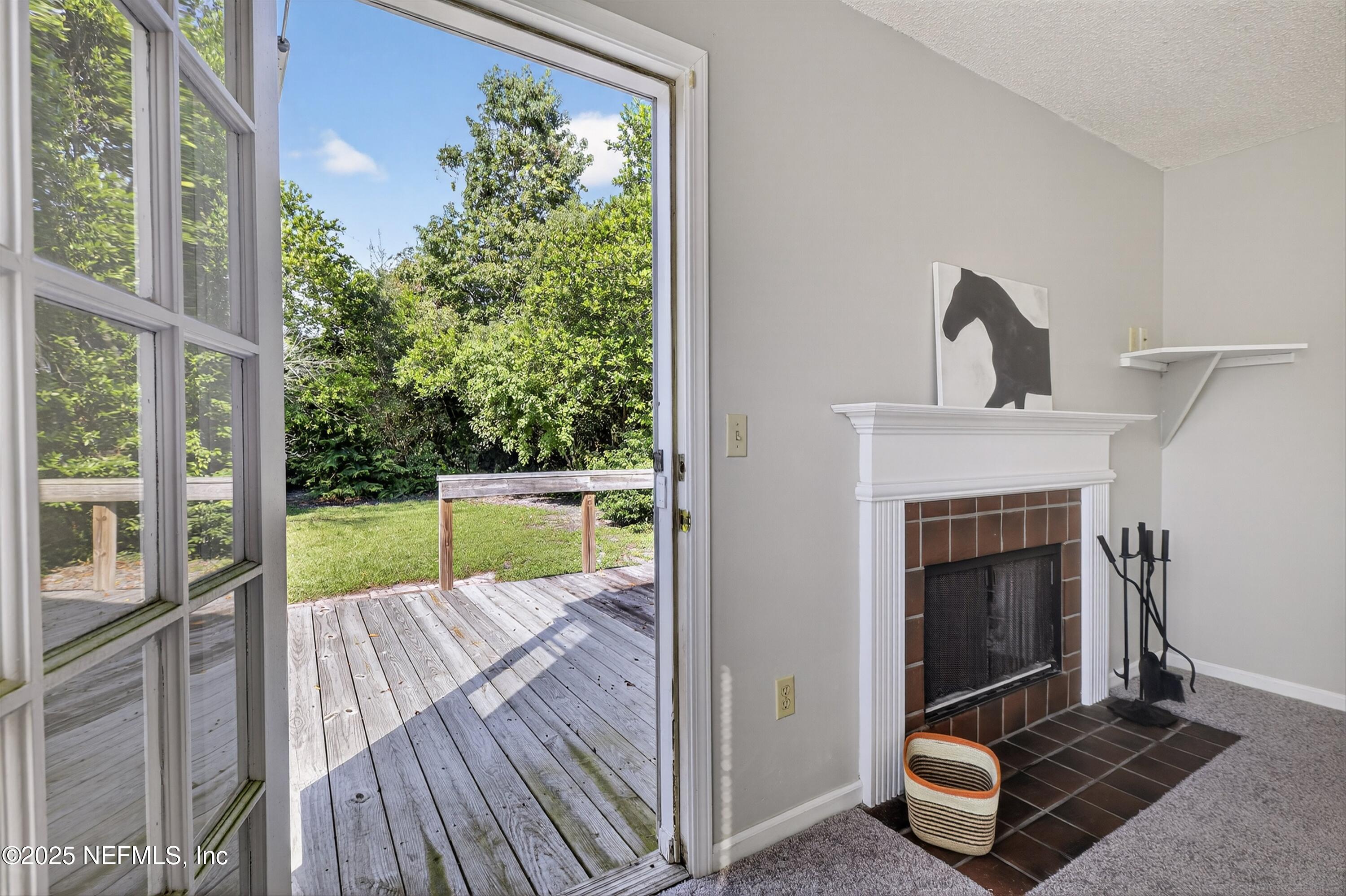 1425 Pinetree Road Jacksonville, FL 32207 - Photo 30 of 39 a view of a living room and a fireplace