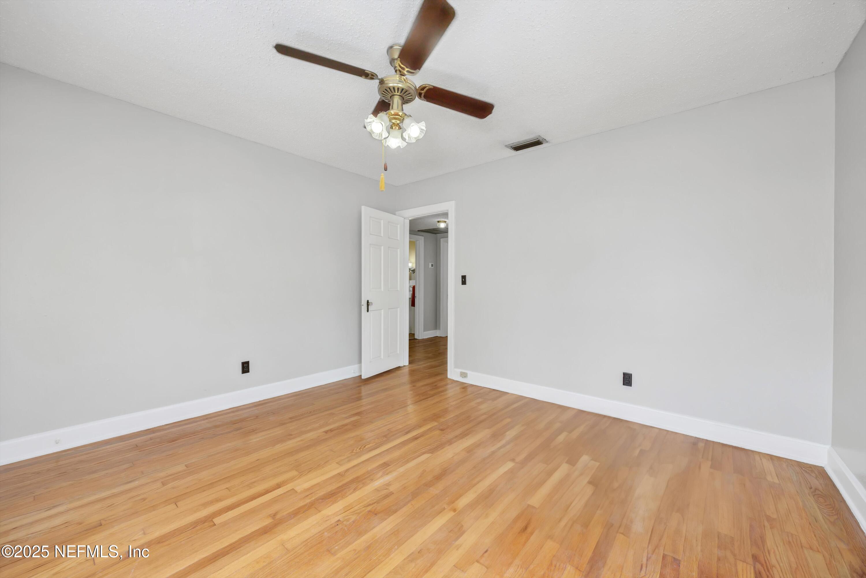 1425 Pinetree Road Jacksonville, FL 32207 - Photo 35 of 39 wooden floor in an empty room