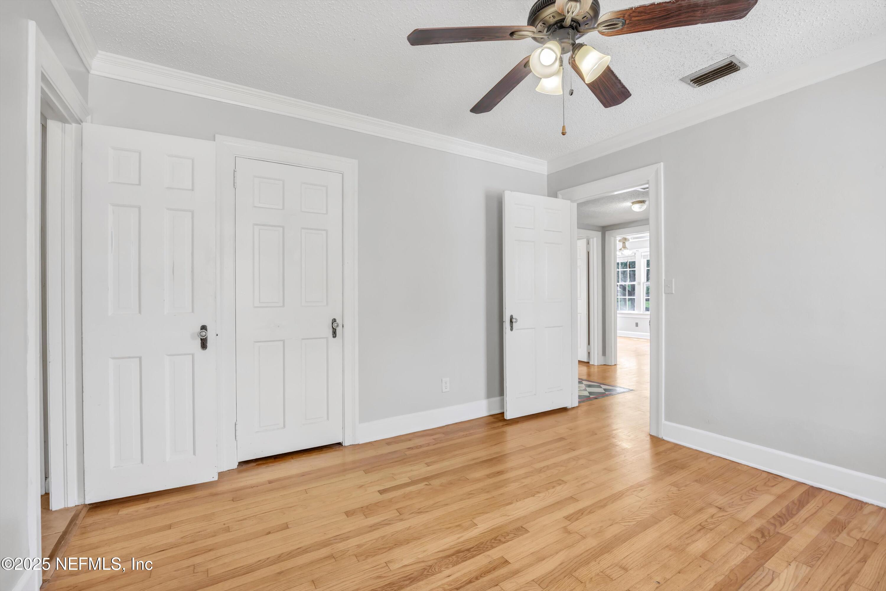 1425 Pinetree Road Jacksonville, FL 32207 - Photo 38 of 39 a view of an empty room and chandelier fan