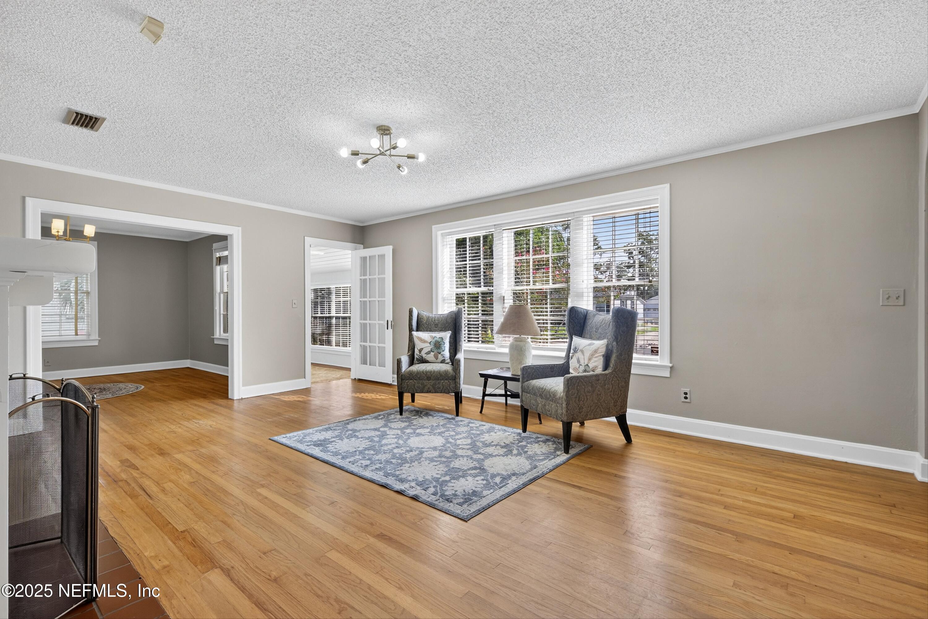 1425 Pinetree Road Jacksonville, FL 32207 - Photo 4 of 39 a living room with furniture and wooden floor