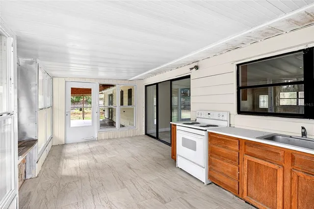 a kitchen with stainless steel appliances granite countertop a stove and a sink
