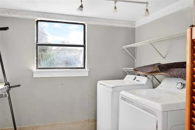 a utility room with dryer and washer