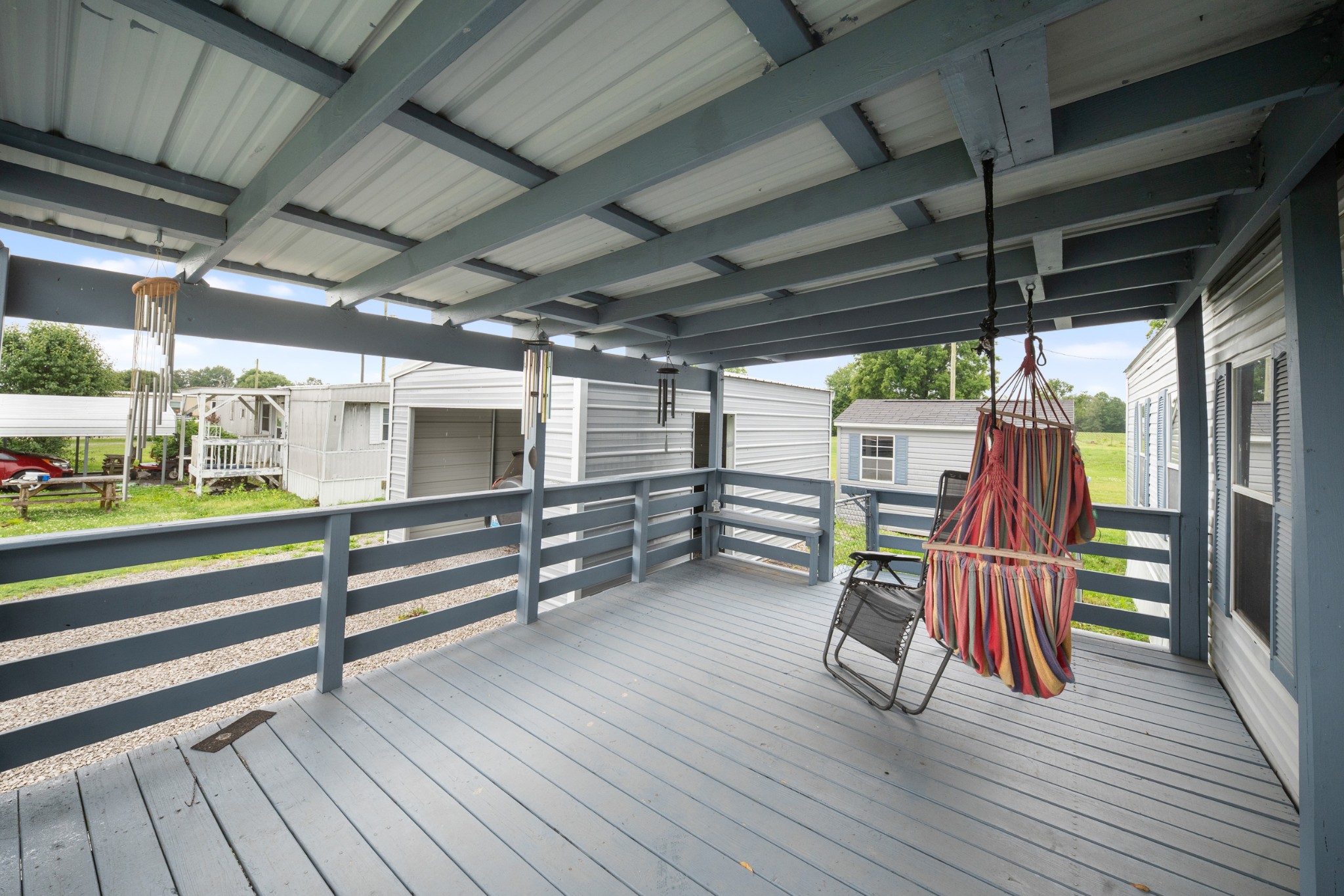 1777 Pond River Road Elkton, KY 42220 - Photo 4 of 21 a view of chairs in wooden deck
