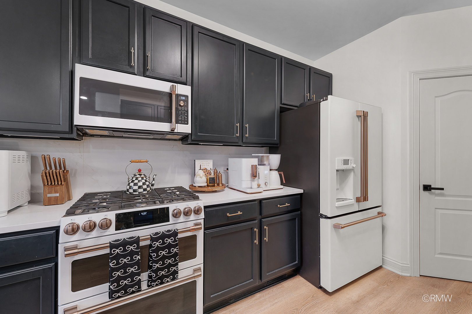 2459 Nicola Court Addison, IL 60101 - Photo 13 of 35 a kitchen with stainless steel appliances a stove a microwave refrigerator and cabinets