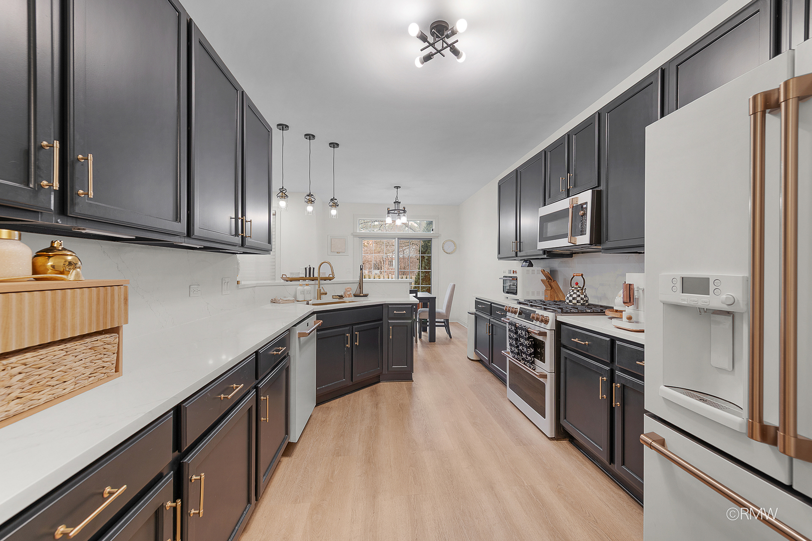 2459 Nicola Court Addison, IL 60101 - Photo 14 of 35 a large kitchen with stainless steel appliances granite countertop a stove a sink dishwasher and a refrigerator