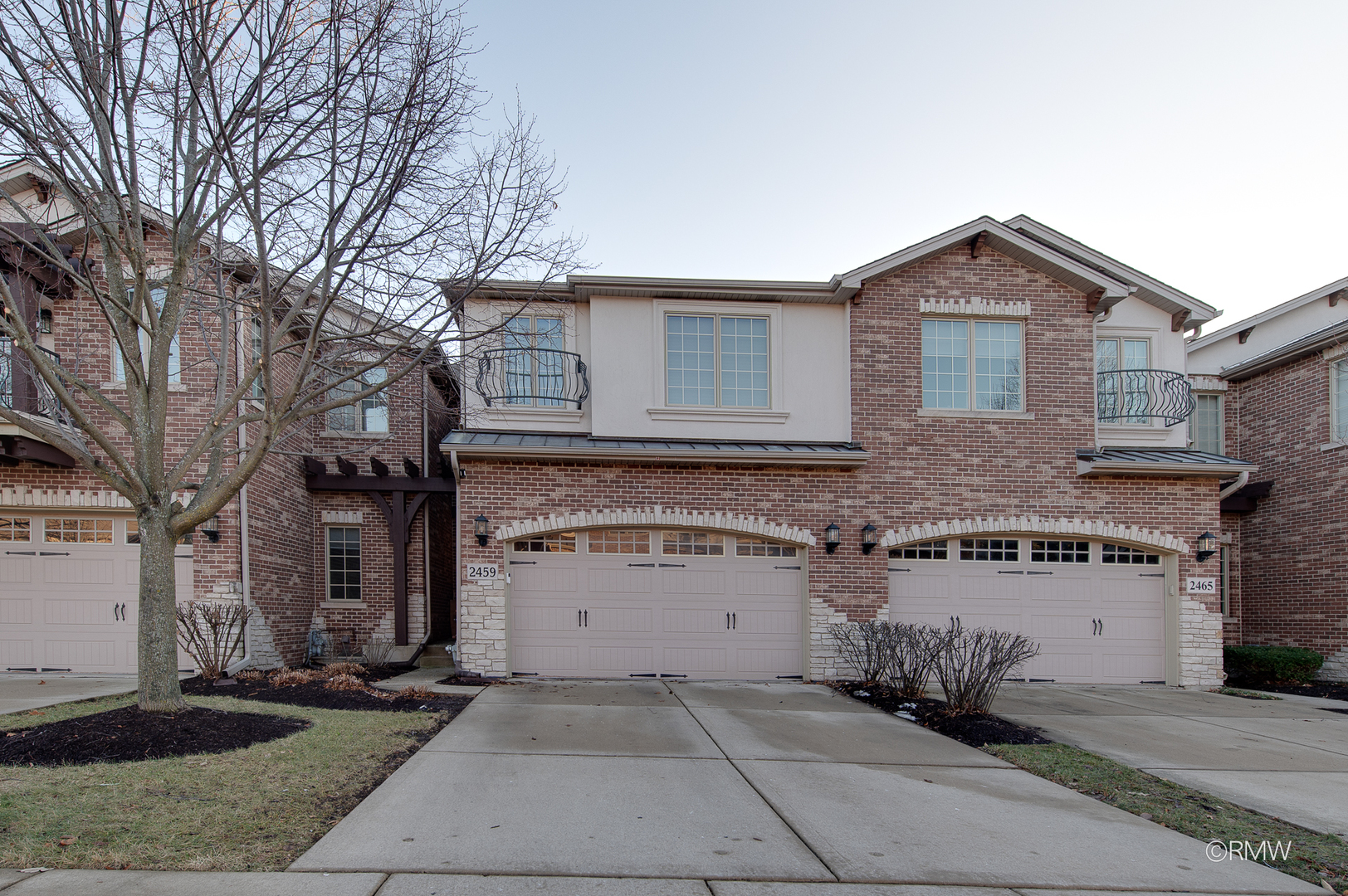 2459 Nicola Court Addison, IL 60101 - Photo 2 of 35 a front view of a house with a yard and garage