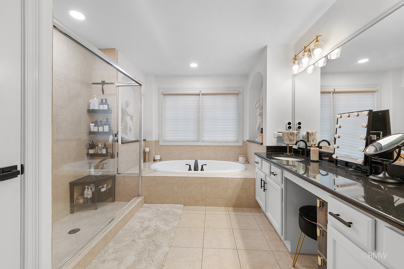 2459 Nicola Court Addison, IL 60101 - Photo 29 of 35 a large spacious bathroom with a large tub sink shower and mirror