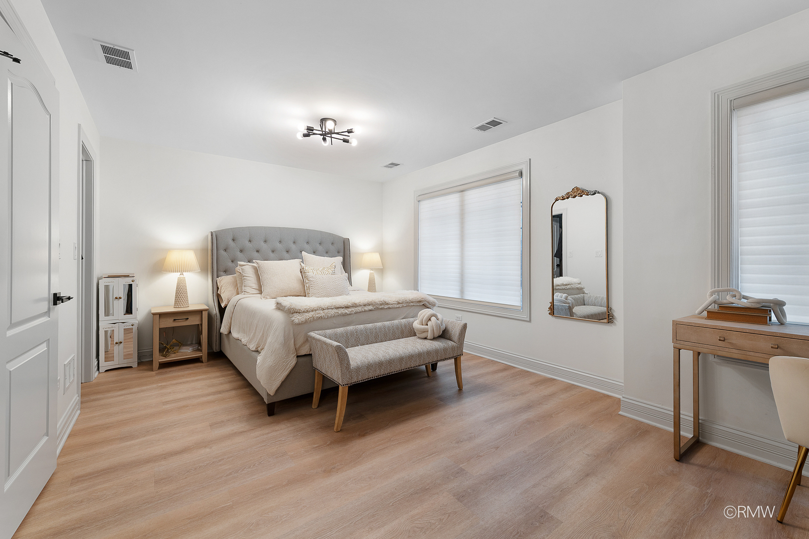 2459 Nicola Court Addison, IL 60101 - Photo 34 of 35 a spacious bedroom with a bed and a chandelier