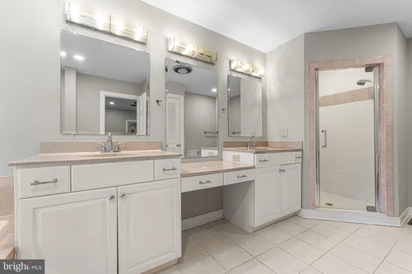a bathroom with a double vanity sink mirror and double