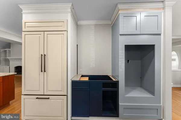 a view of walk in closet with cabinet and floor to ceiling window