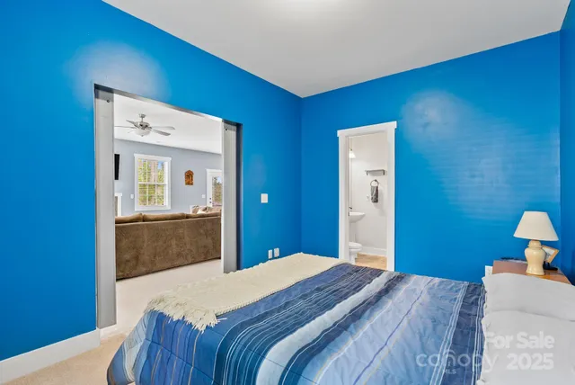 a bedroom with bed and window