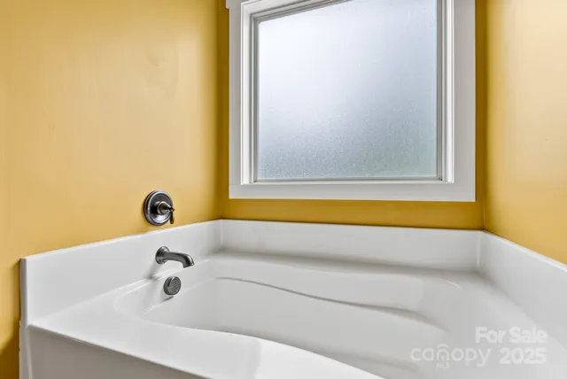 a view of balcony with furniture and garden