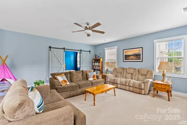 a view of a workspace with a window and lounge chair