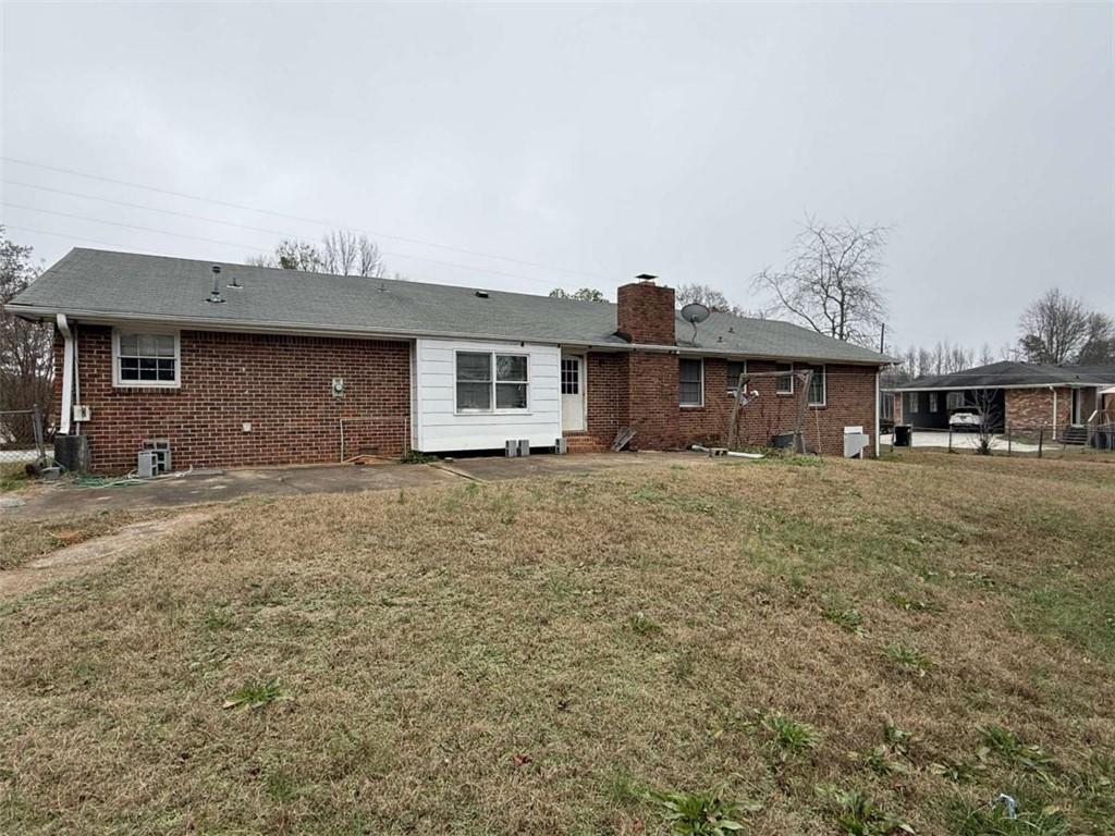 1960 Klondike Road Southwest Conyers, GA 30094 - Photo 15 of 15 a front view of a house with a yard