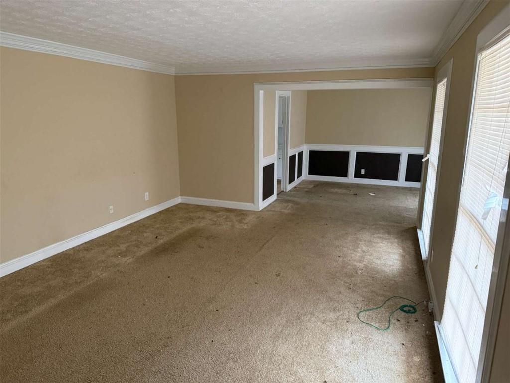 1960 Klondike Road Southwest Conyers, GA 30094 - Photo 3 of 15 a view of a livingroom with a staircase