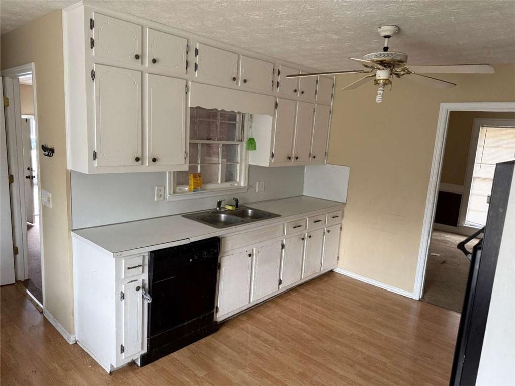 1960 Klondike Road Southwest Conyers, GA 30094 - Photo 6 of 15 a kitchen with stainless steel appliances granite countertop a stove and a refrigerator