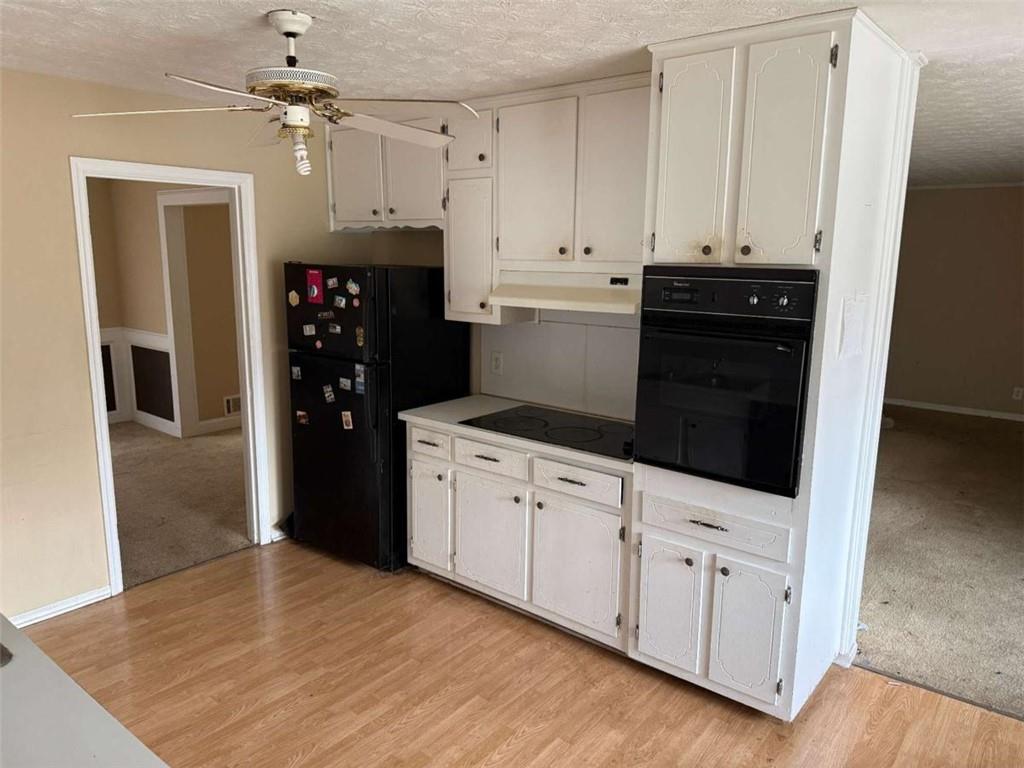 1960 Klondike Road Southwest Conyers, GA 30094 - Photo 7 of 15 a kitchen with stainless steel appliances a refrigerator and cabinets