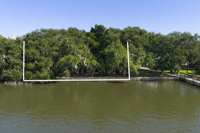 a view of a lake with a house in the background