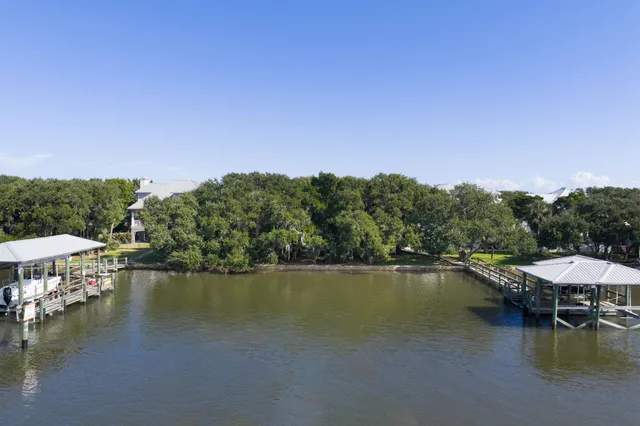 a view of a lake with houses in the background