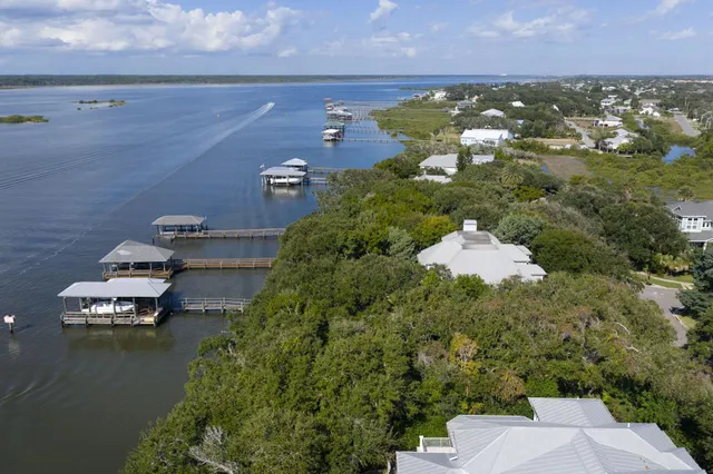 an aerial view of a house with a lake view