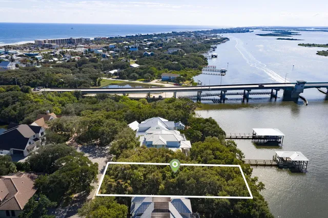 an aerial view of house with yard swimming pool and outdoor seating