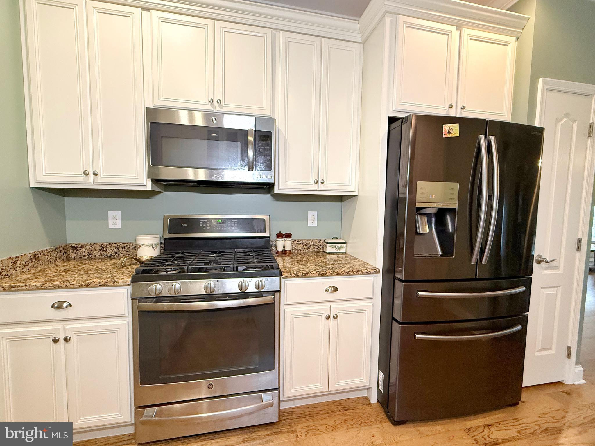 140 Weatherby Lane Glassboro, NJ 08028 - Photo 25 of 85 a kitchen with granite countertop white cabinets and stainless steel appliances