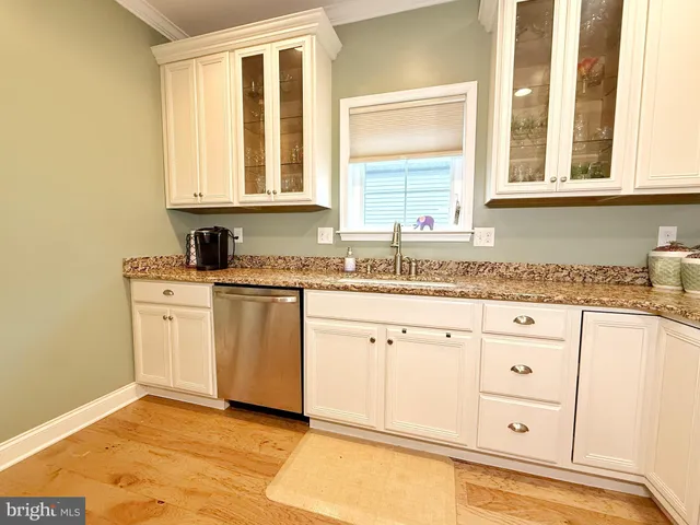 a room with a sink double vanity and a mirror