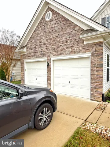 a car parked in front of a house