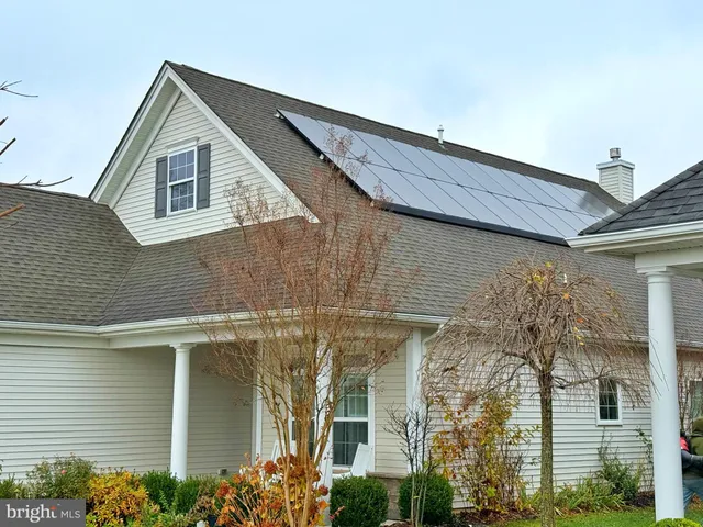 a view of a yard with cars on road