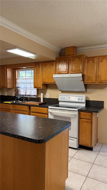 655 Murphy Road Winter Springs, FL 32708 - Photo 12 of 20 a kitchen with stainless steel appliances granite countertop a stove a sink and a granite counter tops