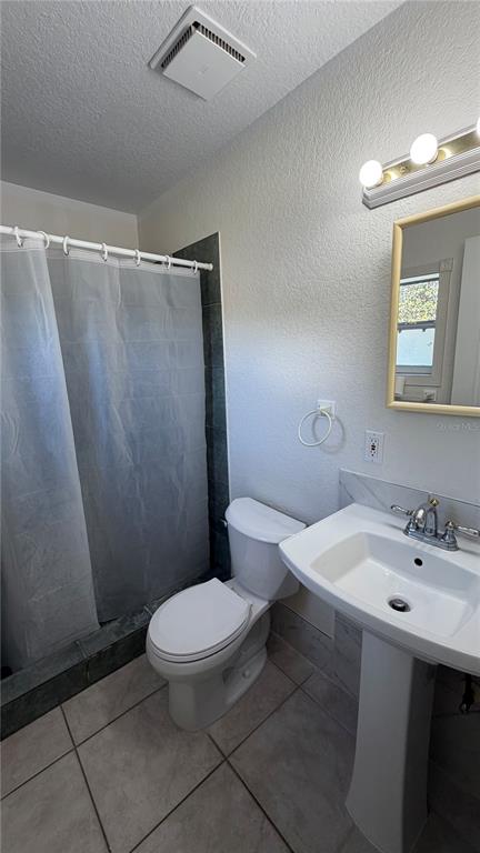 655 Murphy Road Winter Springs, FL 32708 - Photo 17 of 20 a white toilet sitting next to a bathroom sink