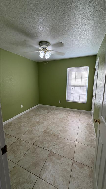 655 Murphy Road Winter Springs, FL 32708 - Photo 18 of 20 a view of empty room with a fireplace and fan