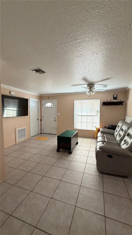 655 Murphy Road Winter Springs, FL 32708 - Photo 3 of 20 a living room with a couch and a stove top oven