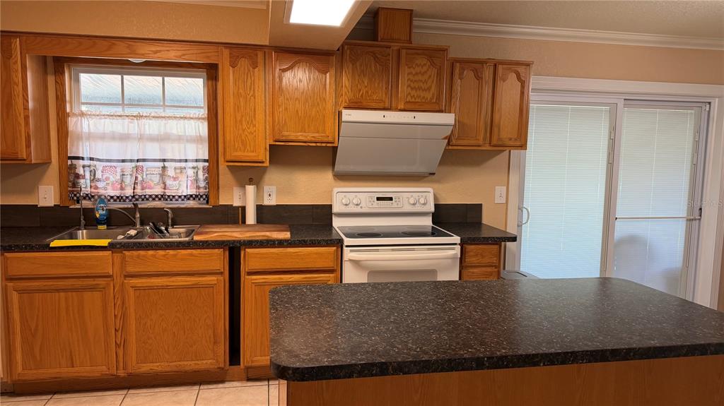 655 Murphy Road Winter Springs, FL 32708 - Photo 5 of 20 a kitchen with appliances a sink and a counter