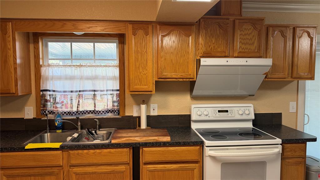 655 Murphy Road Winter Springs, FL 32708 - Photo 8 of 20 a kitchen with a stove and a sink