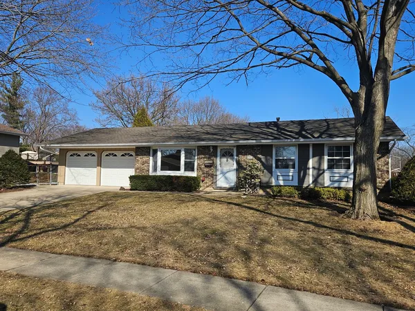 a view of a house with backyard porch and sitting area