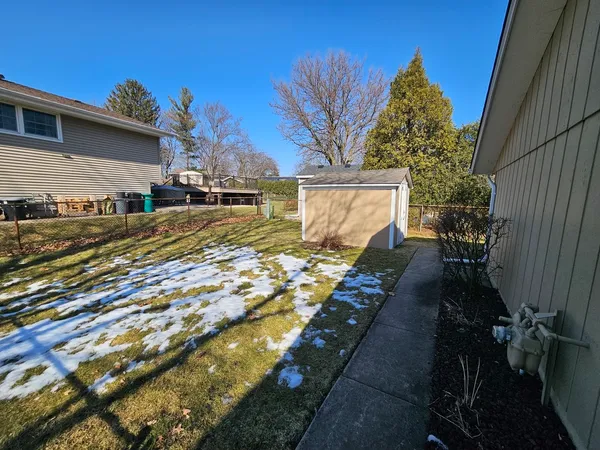 a view of a backyard of the house