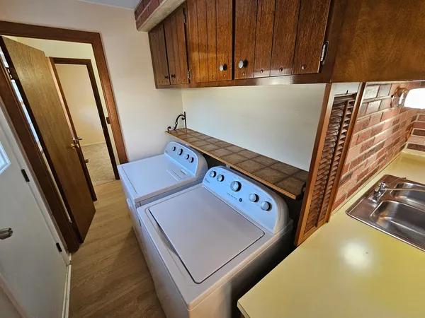 a utility room with dryer and washer