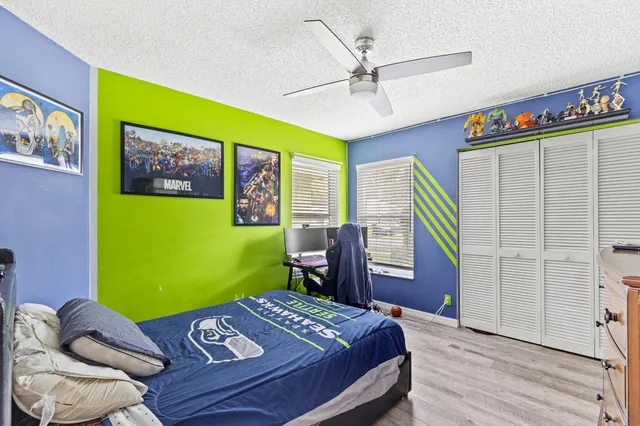 a bed room with a bed and a window