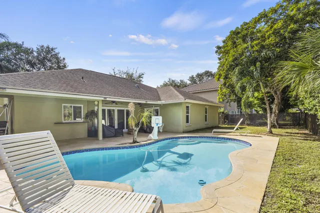 a front view of a house with a yard table and chairs