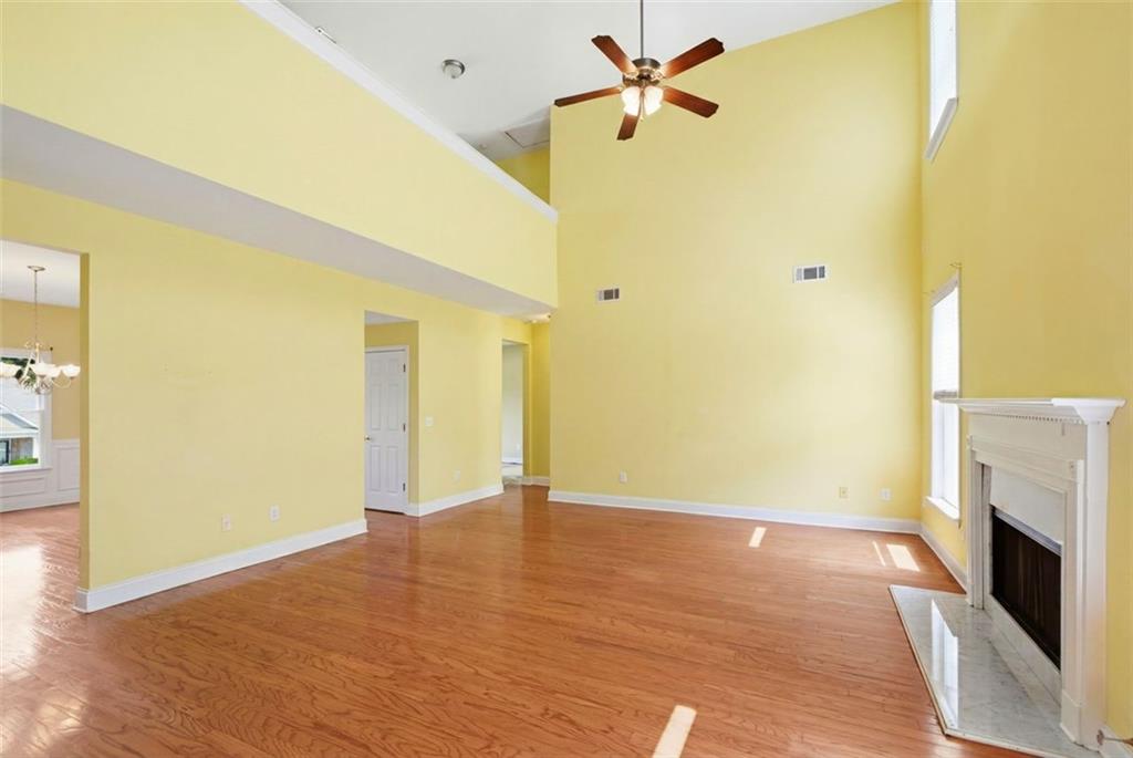 3420 Bulloch Lake Road Loganville, GA 30052 - Photo 15 of 57 a view of empty room with wooden floor and fan