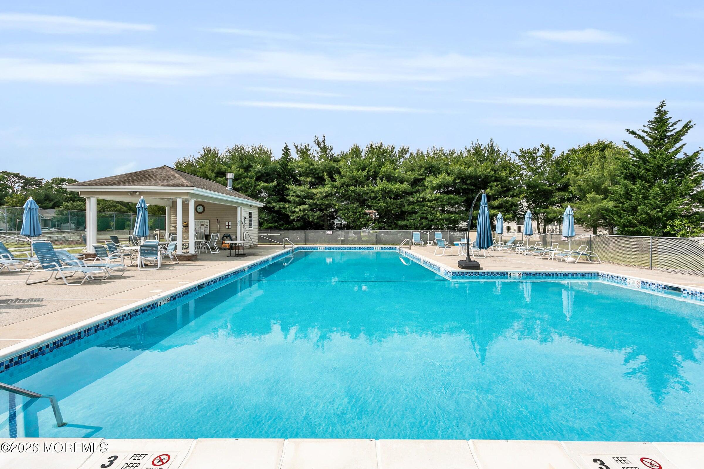 155 Wordsworth Road Brick, NJ 08724 - Photo 39 of 42 a swimming pool with outdoor seating and yard