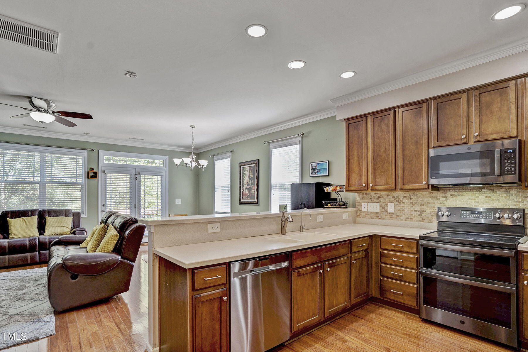 4630 Altha Street Raleigh, NC 27606 - Photo 11 of 31 a kitchen with stainless steel appliances granite countertop a sink and a stove
