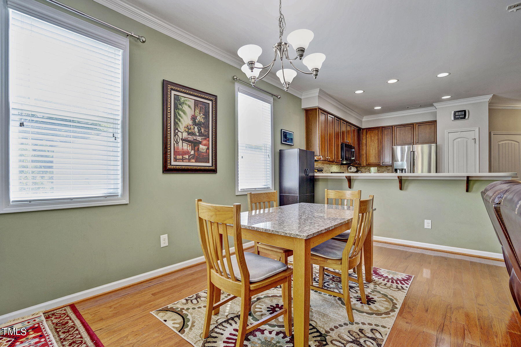 4630 Altha Street Raleigh, NC 27606 - Photo 14 of 31 a view of a dining room with furniture and a chandelier