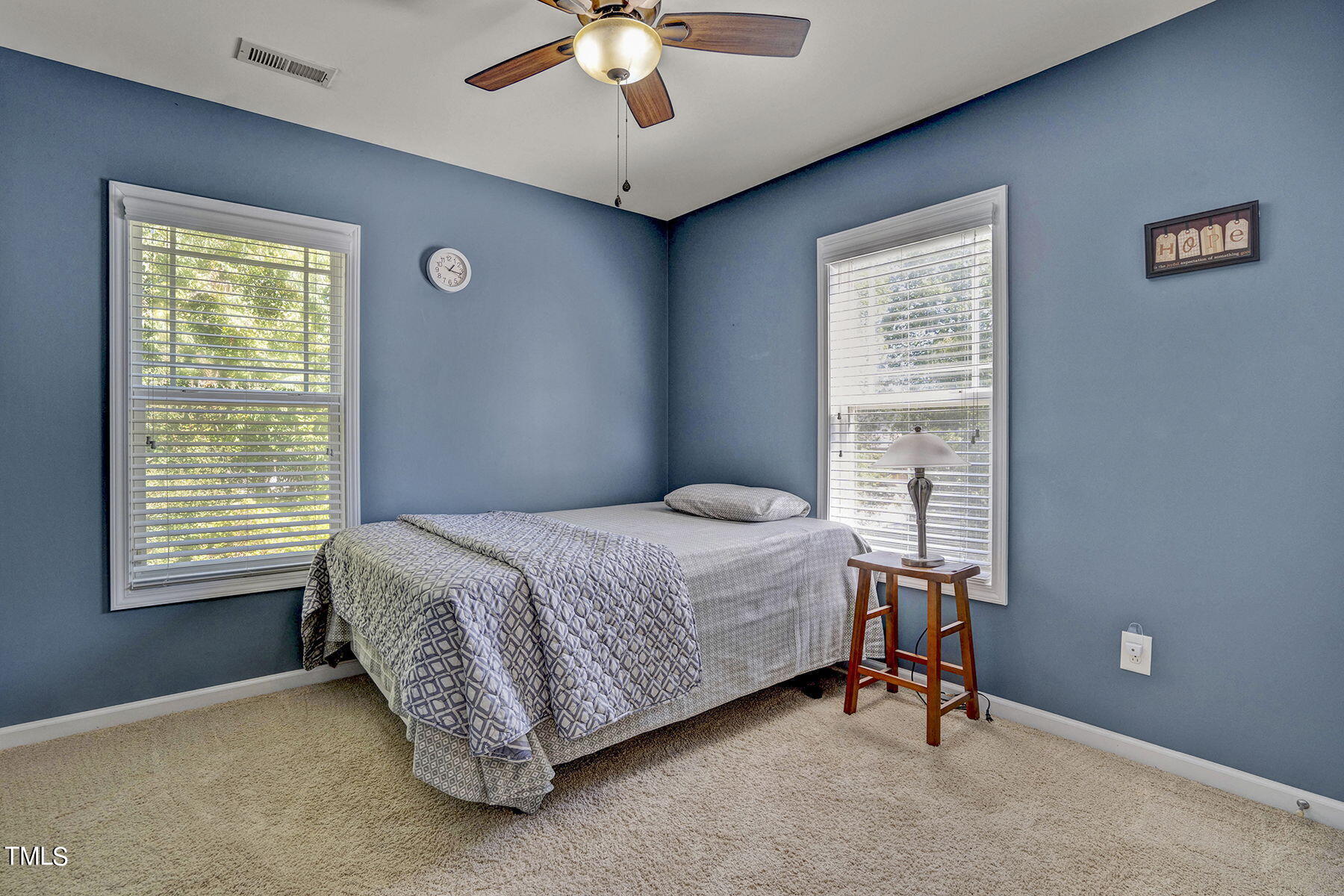4630 Altha Street Raleigh, NC 27606 - Photo 18 of 31 a bedroom with a bed and a window