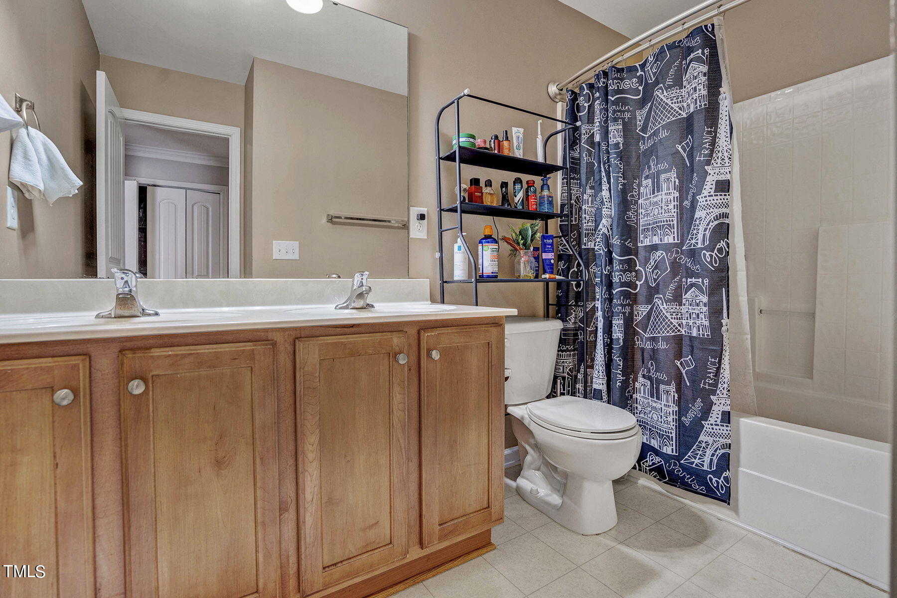 4630 Altha Street Raleigh, NC 27606 - Photo 20 of 31 a bathroom with a sink toilet and shower
