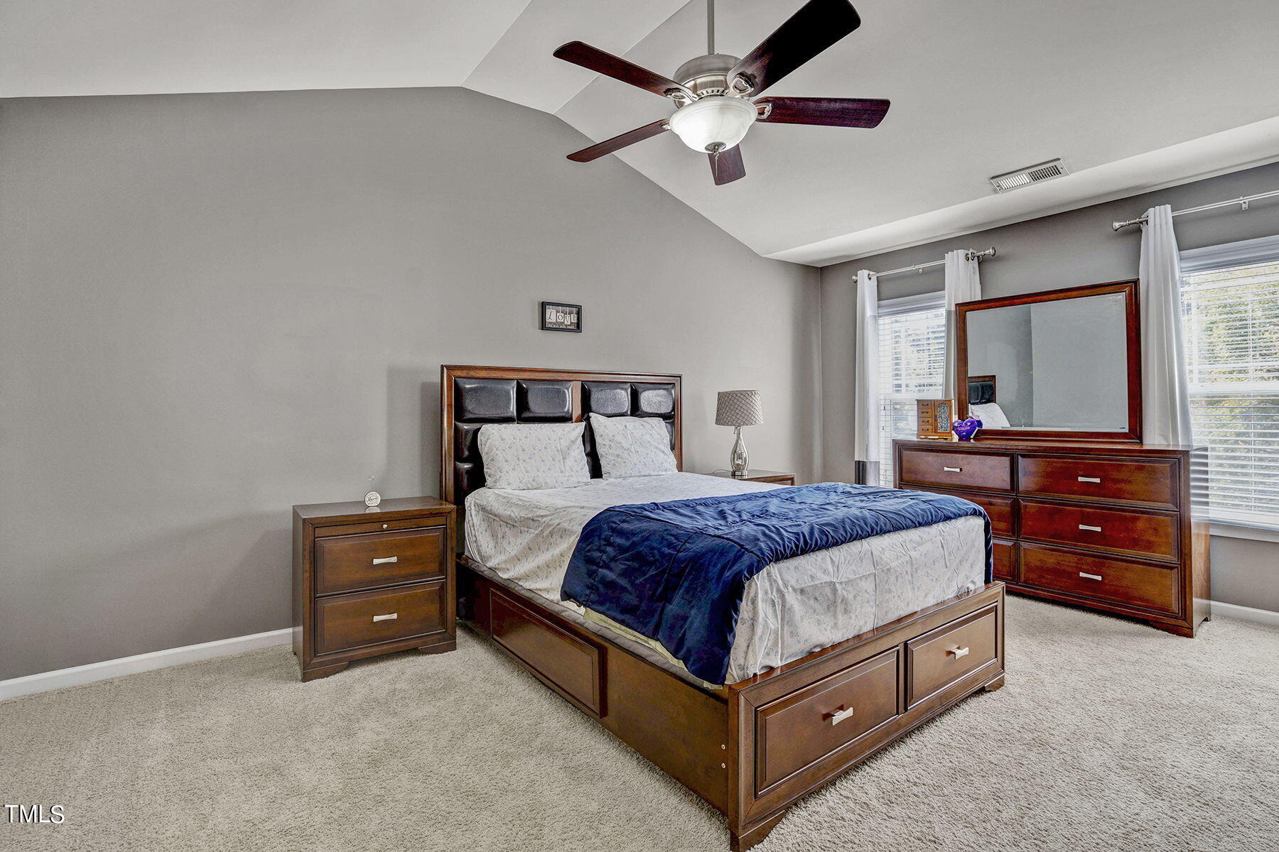 4630 Altha Street Raleigh, NC 27606 - Photo 22 of 31 a bed room with a bed and a television