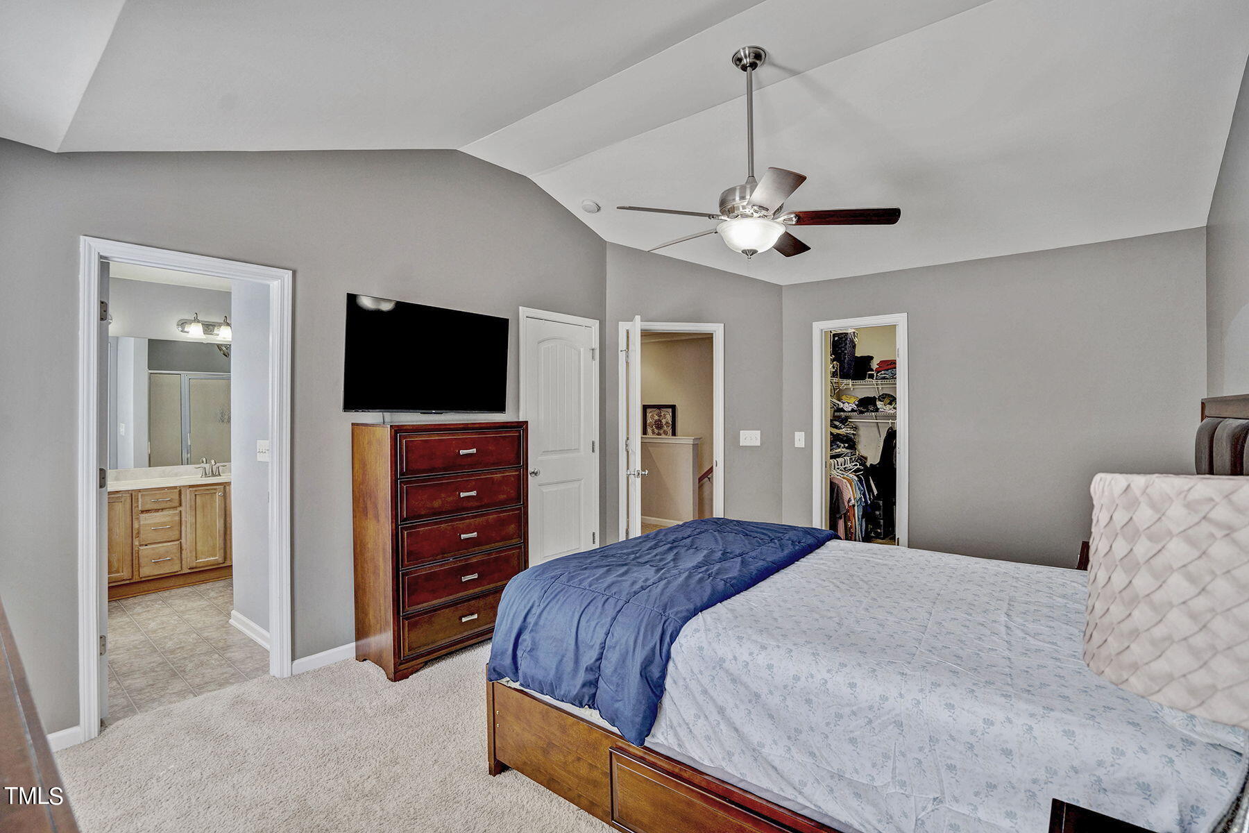 4630 Altha Street Raleigh, NC 27606 - Photo 23 of 31 a bedroom with a bed and a flat screen tv